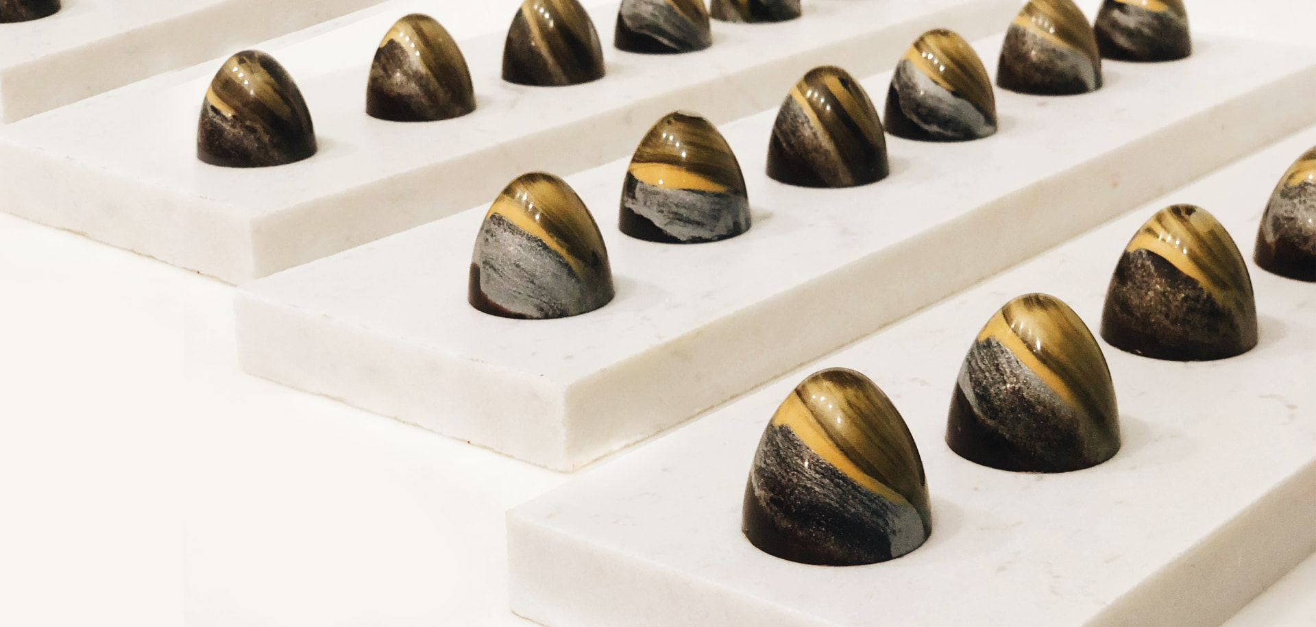 MELT pralines on marble trays